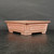 Angled view of the 6 inch unglazed Yixing pot in warm reddish brown