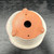Underside of the 5.5 inch round Kakuzan pot on a dark wooden surface