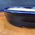 Close-up detail of Reiho dark blue oval bonsai pot showing rounded rim and glazed surface

