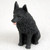 Miniature black Schipperke figurine with a ruffled textured coat