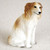 Miniature Borzoi figurine in a sitting position facing right