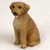 Miniature Rhodesian Ridgeback figurine in an alert sitting position