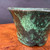 Close view of Shuho green glazed flared round bonsai pot showing glaze detail