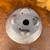 Underside of the Shuho handmade pot showing feet, drain hole and chop