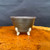 5 inch Shuho metallic glaze round bonsai pot front view with sculptural feet
