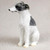 A detailed miniature Whippet dog figurine, designed as a decorative accessory for a bonsai tree or indoor garden. The figurine is shown in a sitting position, looking toward the left with an alert and elegant posture characteristic of the breed. It features a hand-painted white coat with large, dark charcoal gray patches—one covering its head and ears, and another triangular patch on its upper back. The figurine has a slender neck, long muzzle, and fine textured fur details throughout, making it a charming and realistic collectible for dog lovers and bonsai enthusiasts alike.