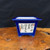 Calligraphy panel centered on the cobalt blue pot's front face