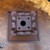 Underside of the cascade pot with a stamped mark and drain hole