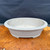 Front view of believed Seizan / Reihou oval bonsai pot showing neutral gray glaze, shallow oval shape, rolled lip, and understated Japanese bonsai container design.
