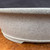 Close-up of believed Seizan / Reihou bonsai pot showing light gray speckled glaze, subtle surface texture, rounded rim, and clean side profile.