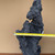 Width measurement across the upper portion of the handmade black planting rock, showing its narrow mountain form and irregular edges.