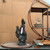 Handmade black mountain rock displayed in an oval bonsai pot beside a wooden stand and miniature tree arrangement for scale; accessories are not included.