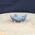 2.25 inch blue glazed freeform bonsai pot handmade by Bruce Lenore, turned view on the stand, No. 173