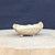 3 inch cream glazed freeform bonsai pot handmade by Bruce Lenore, side view on a wooden stand, No. 175