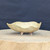 5 inch cream glazed freeform bonsai pot handmade by Bruce Lenore, side view on a wooden stand, No. 177
