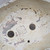 Looking into Bruce Lenore bonsai pot No. 179, showing the drainage holes and the potter's chop