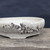 Close-up of the speckled stoneware with rugged rock edge on Andy Arnault bonsai pot No. 732