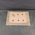 Bottom of Andy Arnault bonsai pot No. 734 with drainage holes and the potter's chop