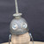 Small handcrafted found-object robot sculpture, robot 22260, closer view of the oil-can head and croquet-ball body