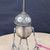 Small handcrafted found-object robot sculpture, robot 22433, closer view of the oil-can head and croquet-ball body