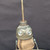 Small handcrafted found-object robot sculpture, robot 22966, closer view of the oil-can head and croquet-ball body