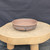 8 inch Paul Olson round bonsai pot, unglazed clay with carved brushwork, No. 621, angled view