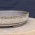 10 inch Paul Olson shallow round bonsai pot, speckled cream glaze, No. 635, close-up of the wall