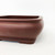 Close-up of the 7 inch Yixing pot's unglazed reddish brown clay