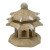 An image of a small, two-tiered Chinese pagoda figurine, isolated against a white background. This miniature architectural piece, designed as a bonsai accessory or garden ornament, is crafted from a light tan material with a coarse, sandy texture that mimics carved stone. The structure sits on a thick, solid base, supporting a central chamber with small arched openings. Two distinct, sloping roof tiers characterize the design, with the lower roof being wider than the top. Both roofs feature several small, white, pointed accents resembling teeth or horns protruding from the eaves. The very top of the pagoda is finished with a small, rounded finial. Its earthy, rustic aesthetic is intended for creating a serene, traditional landscape within a bonsai pot or miniature display.