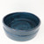 A detailed, high-angle studio shot of an Aussee Dish Garden Pot (ADG-01), showcased against a stark, minimalist white background. This shallow, round ceramic container is finished in a rich, multi-tonal deep blue glaze. 

The pot’s exterior is smooth and glossy, featuring a subtle horizontal ridge that circles the middle, adding a touch of structural detail. The interior of the bowl displays a more artistic, hand-painted quality, with visible, swirling brushstrokes of midnight blue and navy creating a textured, whirlpool-like pattern. The thick, rounded rim is slightly darker, framing the decorative interior. This elegant and durable ceramic dish is specifically designed for creating miniature bonsai landscapes or succulent dish gardens.