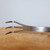 Close-up of the Tinyroots stainless steel root rake for delicate root work