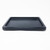 A high-angle, front-slanted view of a classic black Japanese humidity tray, an essential tool for bonsai tree care. The rectangular tray is made of smooth, durable black plastic with rounded corners and a raised, flat-topped rim that creates a shallow, open basin. The interior surface of the tray is flat, designed to hold water and decorative river rocks to increase the local humidity around a bonsai tree. Photographed against a seamless white background, the tray's simple and functional design is highlighted, showing its low-profile silhouette and clean lines. This type of tray is commonly used as a base for indoor bonsai to maintain moisture levels.