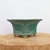 Square glazed Yixing bonsai pot in glossy teal green with recessed panels