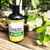 Uncle Bill's No Nitrogen 0-10-10 bonsai fertilizer bottle on a weathered wooden surface