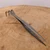 High angle view of the Tinyroots stainless steel root rake and tweezer tool