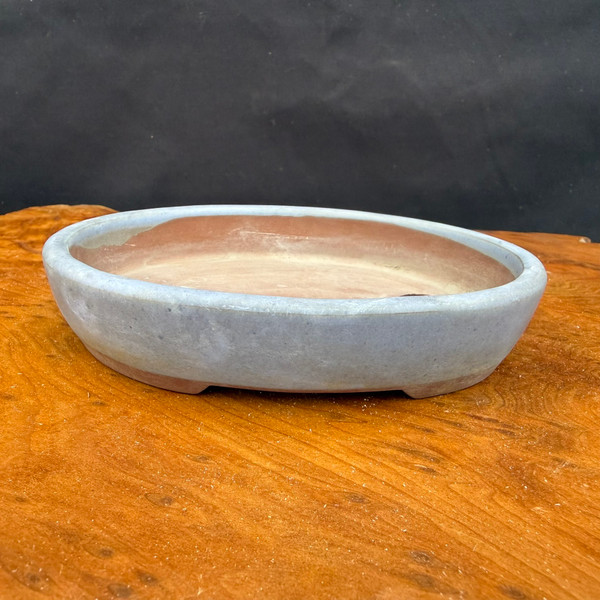 Front view of vintage unglazed oval Seizan Kiln bonsai pot with low profile and weathered surface
