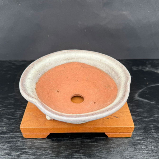 Top view of Kakuzan Tokoname round bonsai pot showing wide planting area, unglazed interior, and central drainage hole