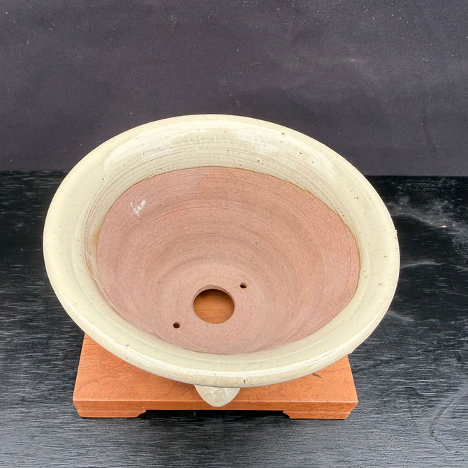 Top view of Kakuzan Tokoname round bonsai pot showing wide planting area, unglazed interior, and central drainage hole