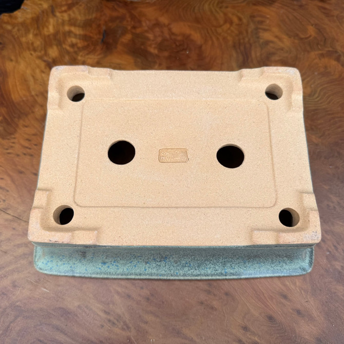 “Underside showing drainage and tie-down holes and Reiho maker’s stamp, Seizan Kiln”