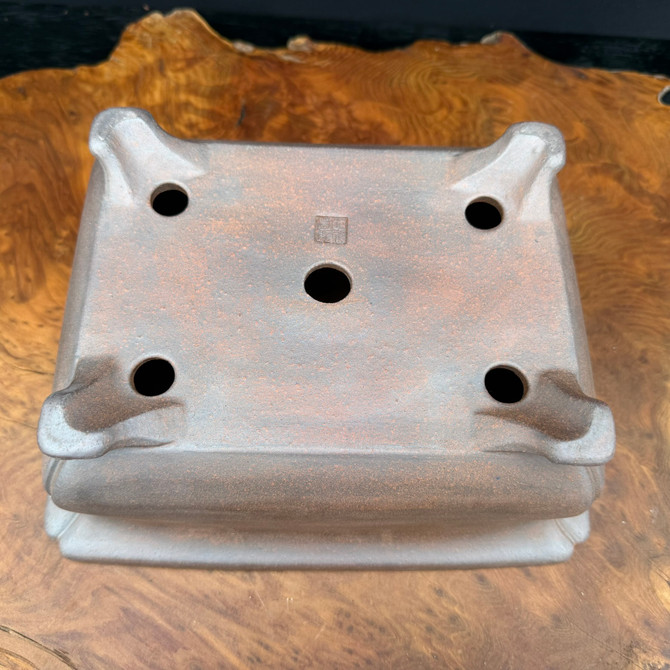 Underside view of Reiho Tokoname bonsai pot with artist chop and foot structure