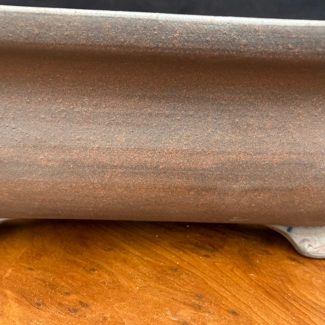 Side detail of deep Reiho Tokoname bonsai pot showing warm reddish-brown unglazed clay
