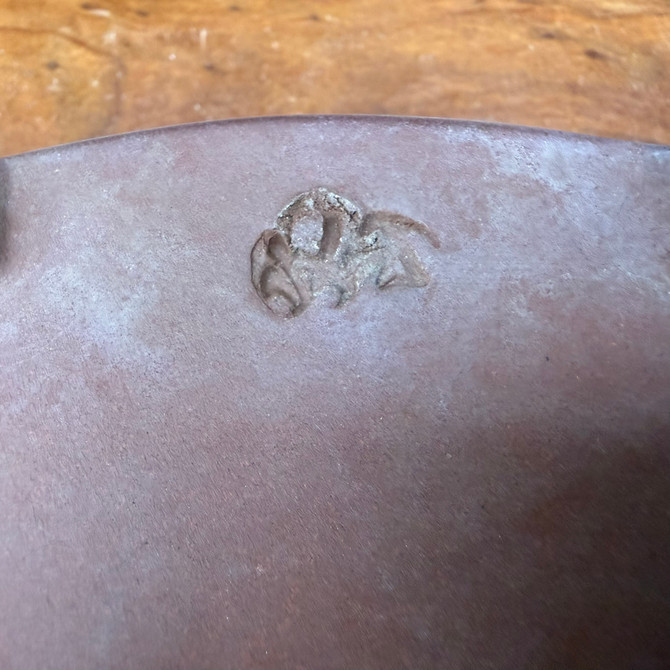 Close-up underside detail of vintage Seizan Kiln bonsai pot showing aged clay surface and character mark