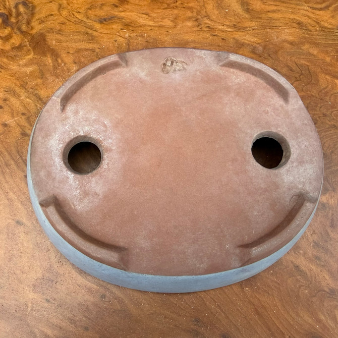 Underside view of old Seizan Kiln oval bonsai pot showing foot structure and wear from use

