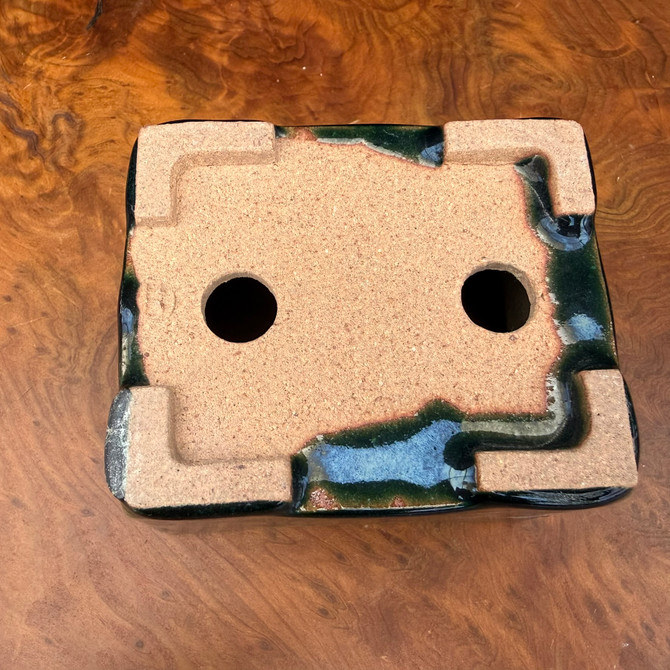 Underside view of Seizan Kiln glazed accent pot showing foot structure and kiln finish