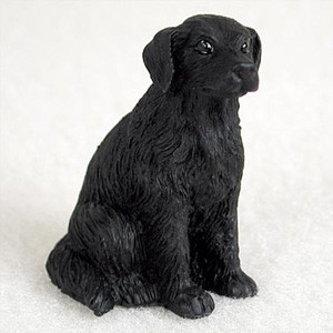 A highly detailed miniature figurine of a Flat-Coated Retriever dog, specifically designed as a decorative accessory for bonsai trees or miniature gardens. The figurine is depicted in a classic sitting pose, facing slightly toward the right. It is entirely black, featuring intricate molded textures that realistically represent the breed’s characteristic long, flowing, and slightly wavy coat. The small dog has floppy ears and lifelike eyes that give it an alert and loyal expression. Set against a soft, textured white background, the figurine's clean craftsmanship is highlighted, demonstrating how it can add a sense of life, scale, and personal flair when placed within a bonsai pot or indoor garden display.