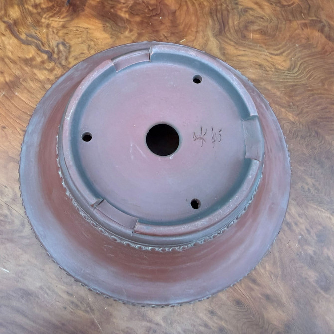 Bottom view of 8 inch Bigei Tokoname round bonsai pot showing feet, drainage hole, and Bigei signature
