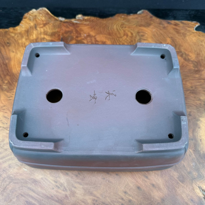 Bottom view of 9.75 inch Bigei Tokoname rectangle bonsai pot showing feet, drainage holes, and Bigei signature