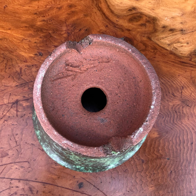 Bottom view of Shuho handmade round bonsai pot showing base and drainage hole