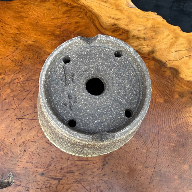 Bottom view of Shuho handmade bonsai pot showing base, feet, drainage hole, and artist chop