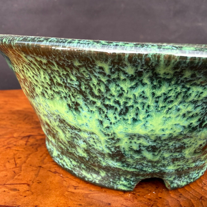 Close view of Shuho green glazed round bonsai pot showing glaze detail